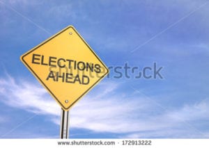 stock-photo-yellow-road-warning-sign-elections-ahead-172913222